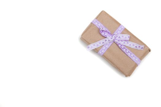 present on a white background with lilac ribbon bow brown paper