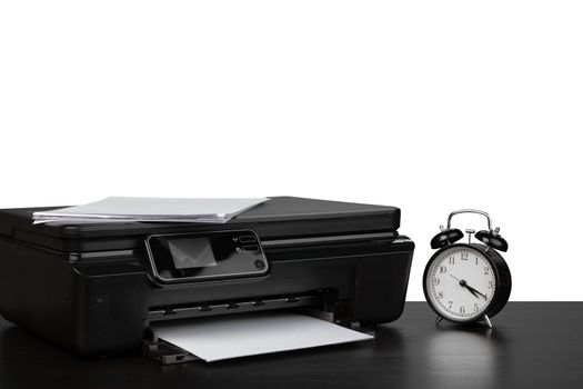 Laser home printer on table against white background, close up