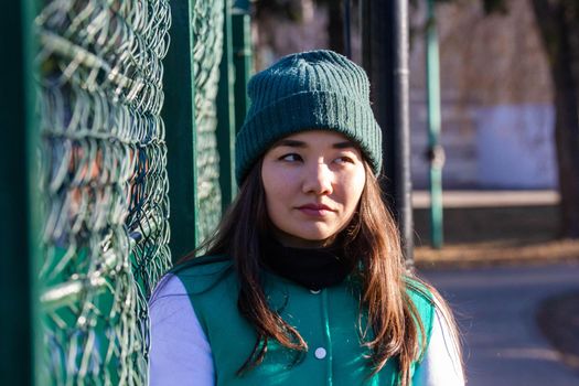 Young woman standing in a sport costume. Portrait