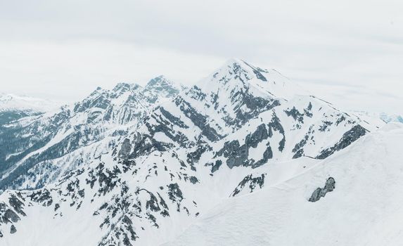 Beautiful Caucasian mountains in winter. Peaks of mountains