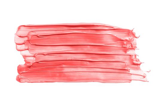 Big Rectangular pink or coral brush strokes or smears isolated on white background. Top view. Mock up with copy space. Pink metallic make-up smear swatch sample