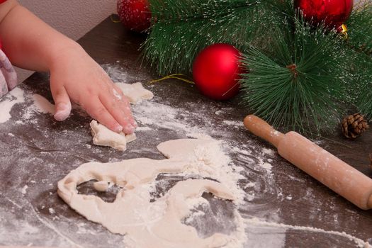 children's hand sculpt cookies, new year, christmas background, copy place, cookie in the shape of a star, dark wooden table