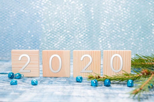 new year 2020, spruce branch, blue background
