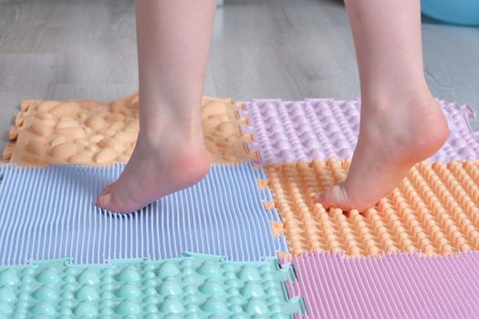 Foot massage mat for babies. Prevention of flat feet and hallux valgus. Orthopedic massage puzzle mats for the development of children.