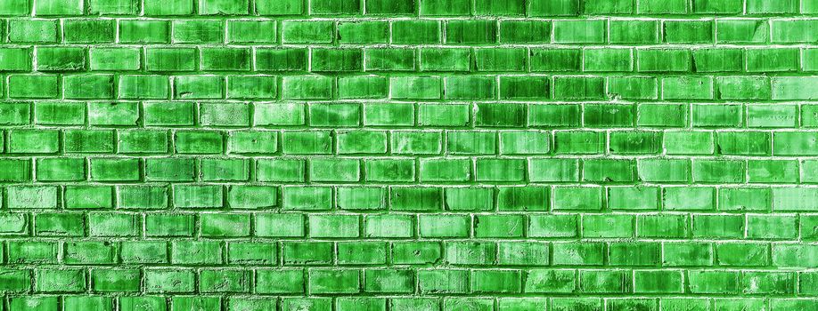 Green Brick wall texture close up. Top view. Modern brick wall wallpaper design for web or graphic art projects. Abstract background for business cards and covers. Template or mock up.