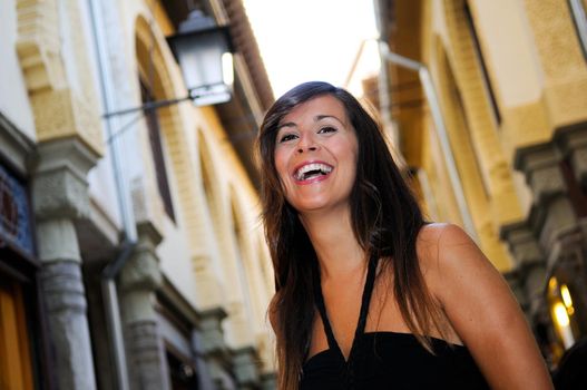 Portrait of an attractive smiling woman in urban background