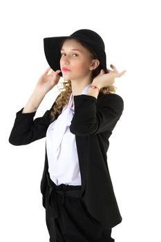 Beautiful woman in classic elegant outfit and hat. Half turned portrait of pretty girl wearing black blazer, white blouse touching her wide brimmed hat against isolated white background