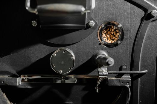 Coffee processing. Roastery, roasting machine and fresh beans