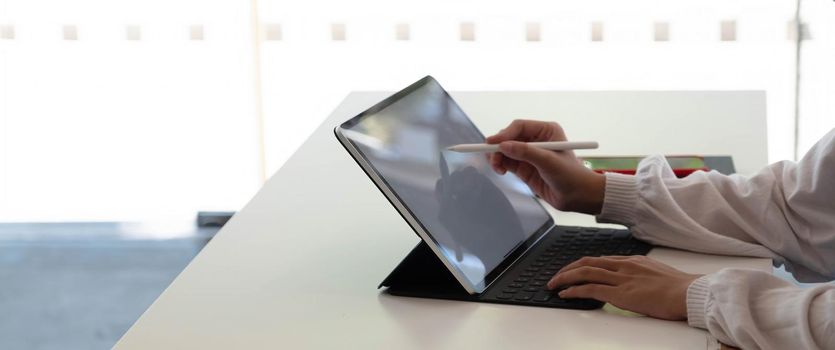 Businesswoman using laptop blank screen while working with calculator for financial. Clipping path.