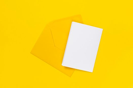 Blank white card with yellow envelope isolated on yellow background. Template or mock up. Banner with copy space.