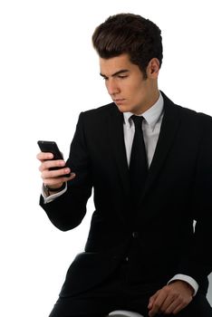 Portrait of a handsome businessman talking on the cellphone , isolated on white background