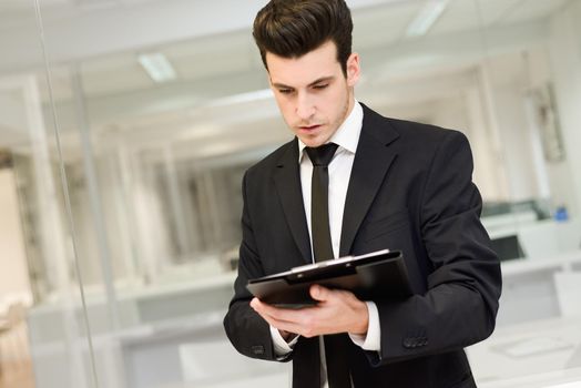 Portrait of a young businessman in an office