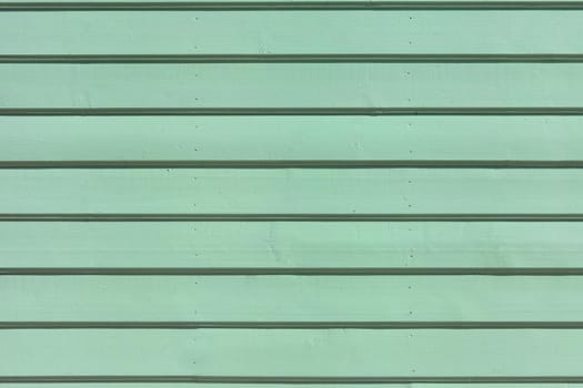 wooden painted planks surface. greenish aquamarine timber wall texture for background or wallpaper