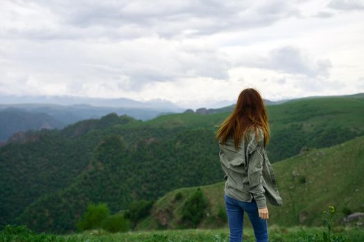 woman outdoors in the mountains travel landscape fresh air. High quality photo