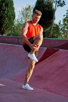 man doing exercises outdoors in the park. High quality photo