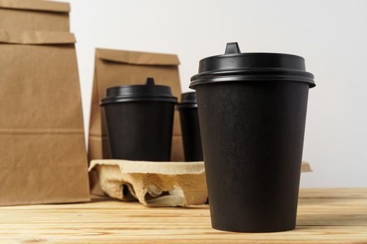 Paper bags with take away food and coffee cups containers. Lunch box