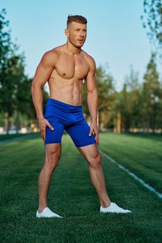 man in the park workout outdoor exercise. High quality photo