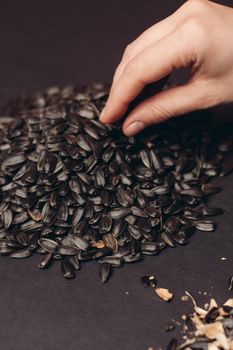 natural product sunflower seeds handing close-up food. High quality photo