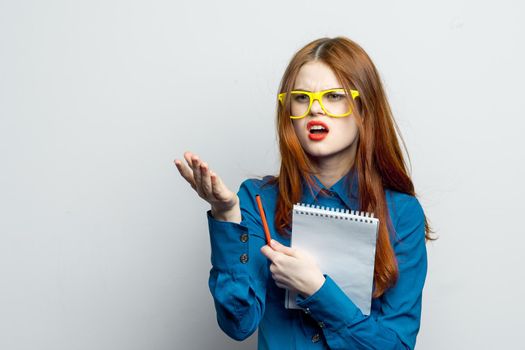 woman secretary with yellow glasses notepad work official. High quality photo