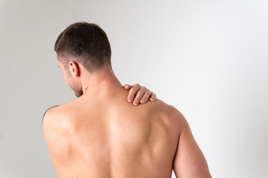 The muscles of the neck in a man on a white background are hurt body painful, backache man background stress, muscular chronic. red sickness, disease suffer attractive