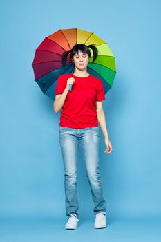 cheerful woman in red t-shirt rainbow color umbrella fashion. High quality photo