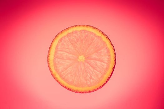 orange slice on purple background