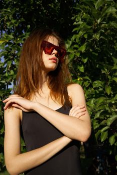 pretty woman wearing sunglasses summer nature posing. High quality photo