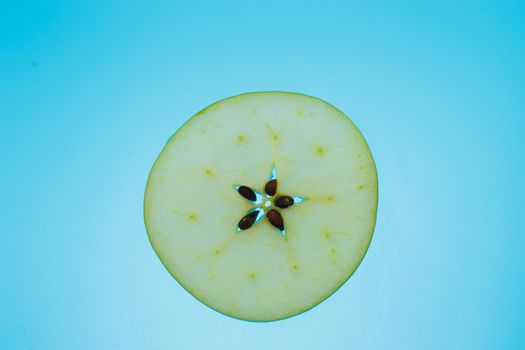 apple slice on azure background