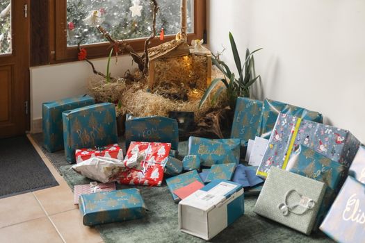 Many gifts under the tree for a Christmas
