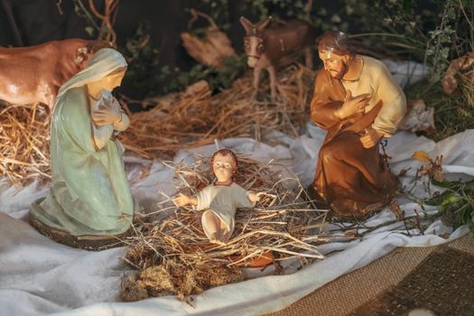 Christmas creche with Joseph Mary and small Jesus in a crib