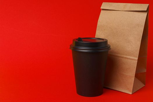 Takeaway food concept. Some packed food in container with coffee cup on table