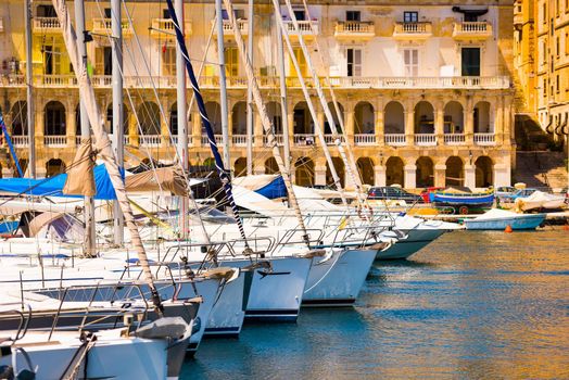 a number of yachts in a bay near Valletta in Malta