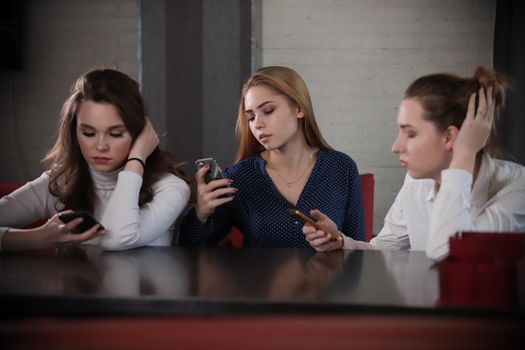 Young beatiful women communicated at comfortable cafeteria while waiting friend. portrait