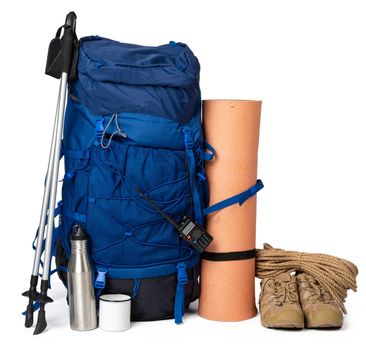 Blue hiking backpack with fitness mat isolated on white background