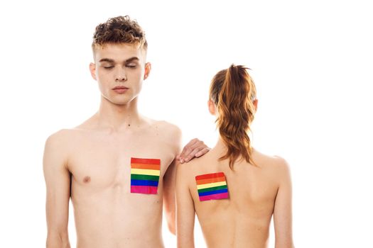 young couple lgbt Flag transgender lifestyle light background. High quality photo