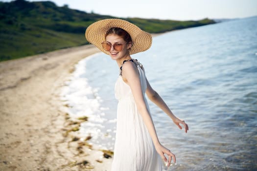 pretty woman with hat on island beach ocean summer fun. High quality photo