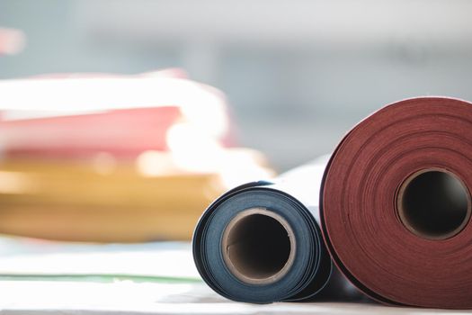 Rolls of paper for the printing production in the printing house, close up