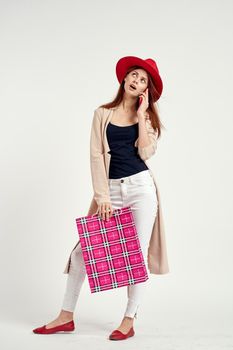 beautiful woman wearing a red hat posing shopping fun isolated background. High quality photo