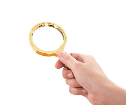 hand holding a Brass Magnifying Glass isolated on white background