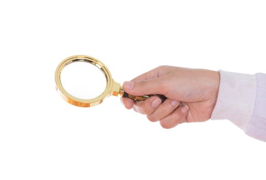 hand holding a Brass Magnifying Glass isolated on white background