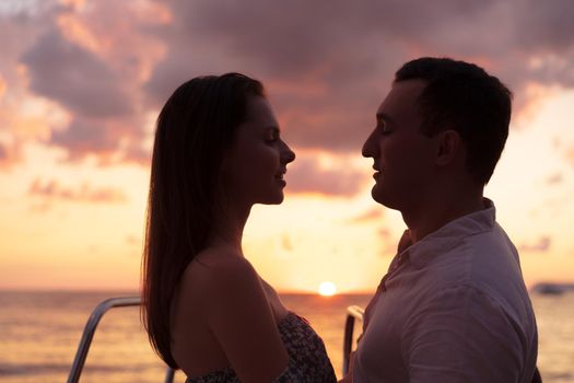 Romantic sensual young couple in love at the sunset, close up