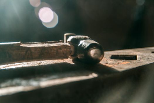 Workspace of blacksmith. the hammer lies on the anvil. Close up shot