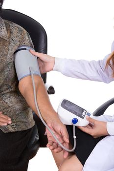 close-up of Female doctor measuring blood pressure of senior woman