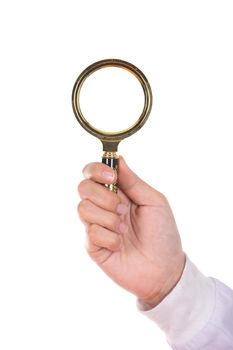 hand holding a Brass Magnifying Glass isolated on white background