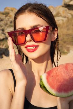 woman eating watermelon outdoors Sun summer close-up. High quality photo