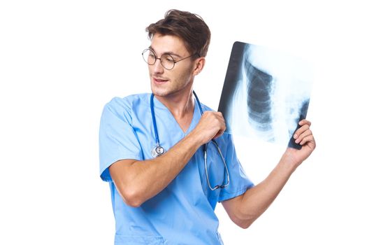 man in medical uniform x-ray diagnostics stethoscope examination work isolated background. High quality photo