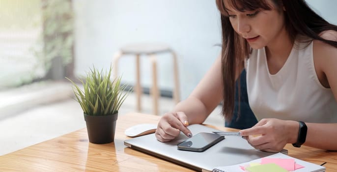 Woman use mobile phone for shopping online with credit card.