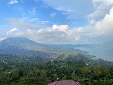 Hiking around the crater of Mount Batur with Mount Agung in the background