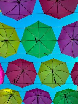 Low Angle View Of Colorful Umbrellas Hanging Outdoors - stock photo. High quality photo