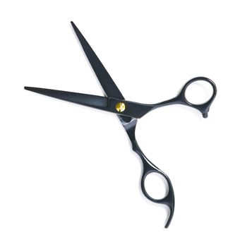 professional hairdresser black scissors isolated on white. Black barber scissors, close up. flat lay